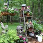 Rustic - Farmhouse DIY garden decoration with old wooden ladders .