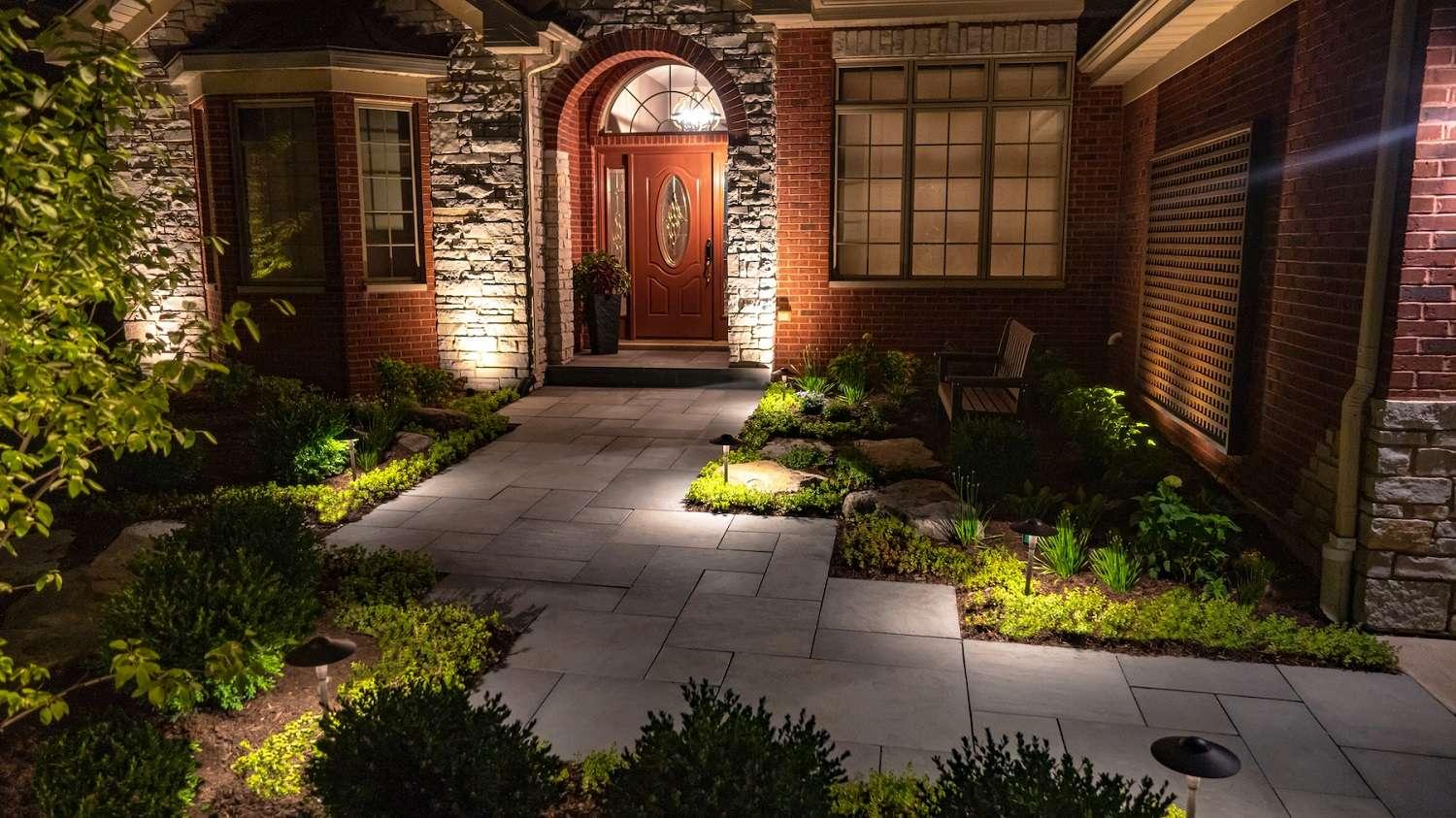 Utilize outdoor lighting to highlight key features in your front yard landscaping