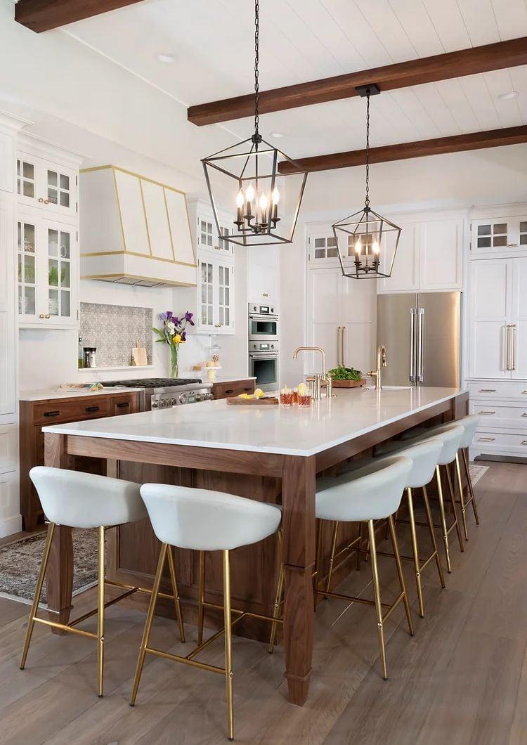 Soft pendant lighting adds ambiance to the heart of your farmhouse kitchen