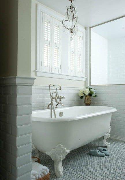 Vintage clawfoot tubs bring elegance to farmhouse bathrooms