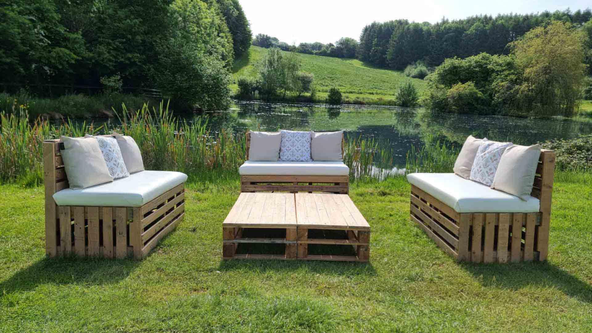 Arrange a pallet‌ garden atop an old table for a unique gardening approach