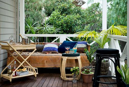 Incorporate a small bar cart for refreshments on your screened porch