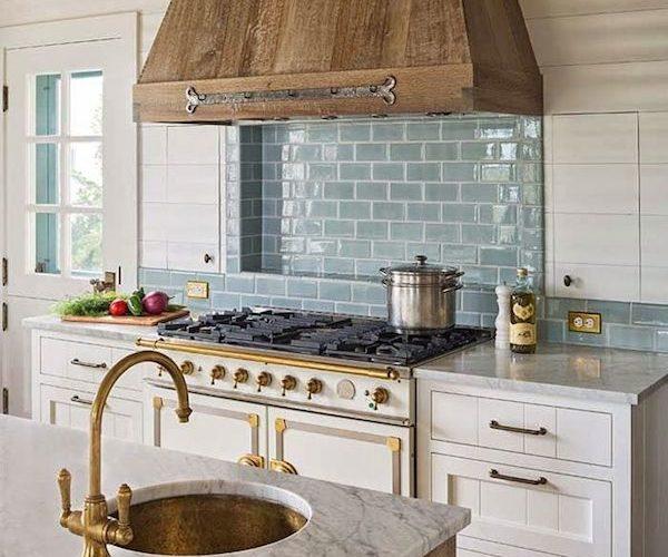 An attractive farmhouse-style range hood elevates your Farmhouse Kitchens aesthetic