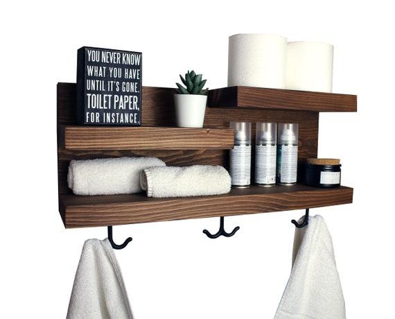 Hang hooks for towels to clear clutter in a small bathroom