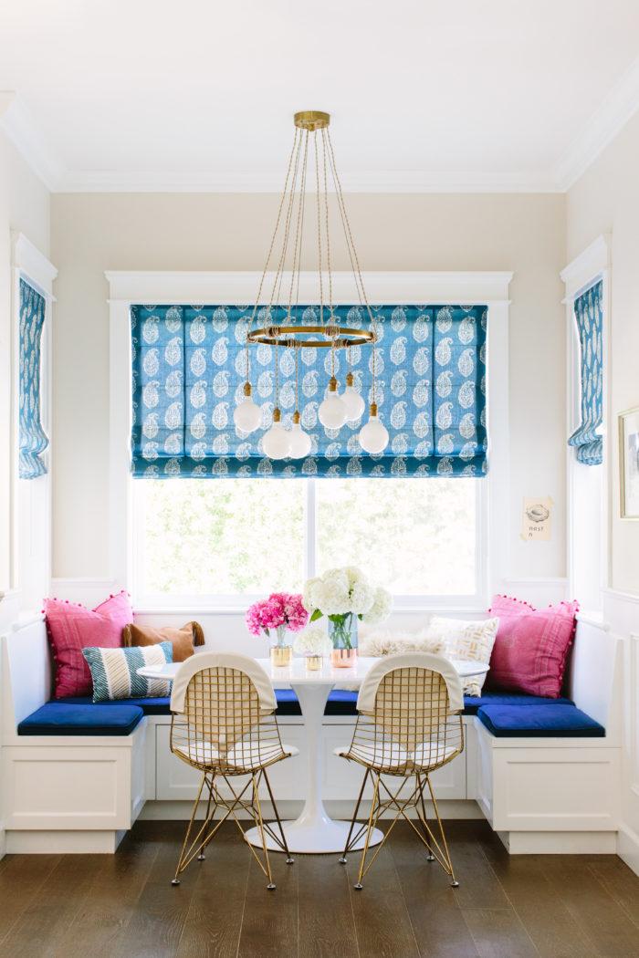 Introduce a cozy nook with cushions to encourage relaxation in your Eat-In Kitchen