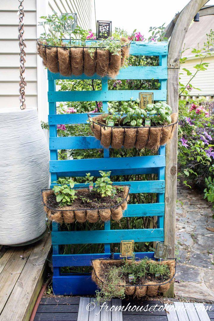 Elevate your gardening game by creating a hanging pallet garden for space-saving beauty