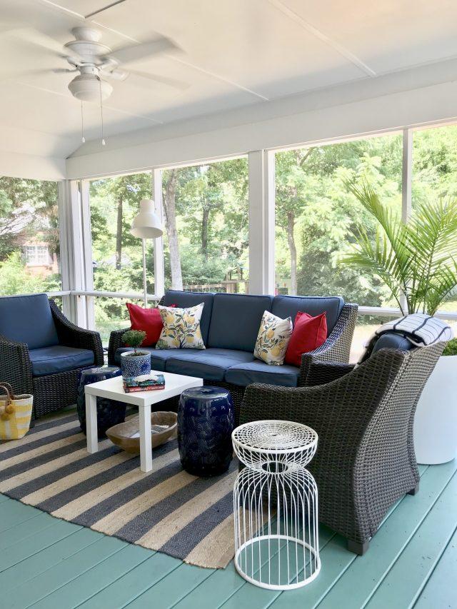 Use outdoor rugs to define spaces and add color to your screened porch