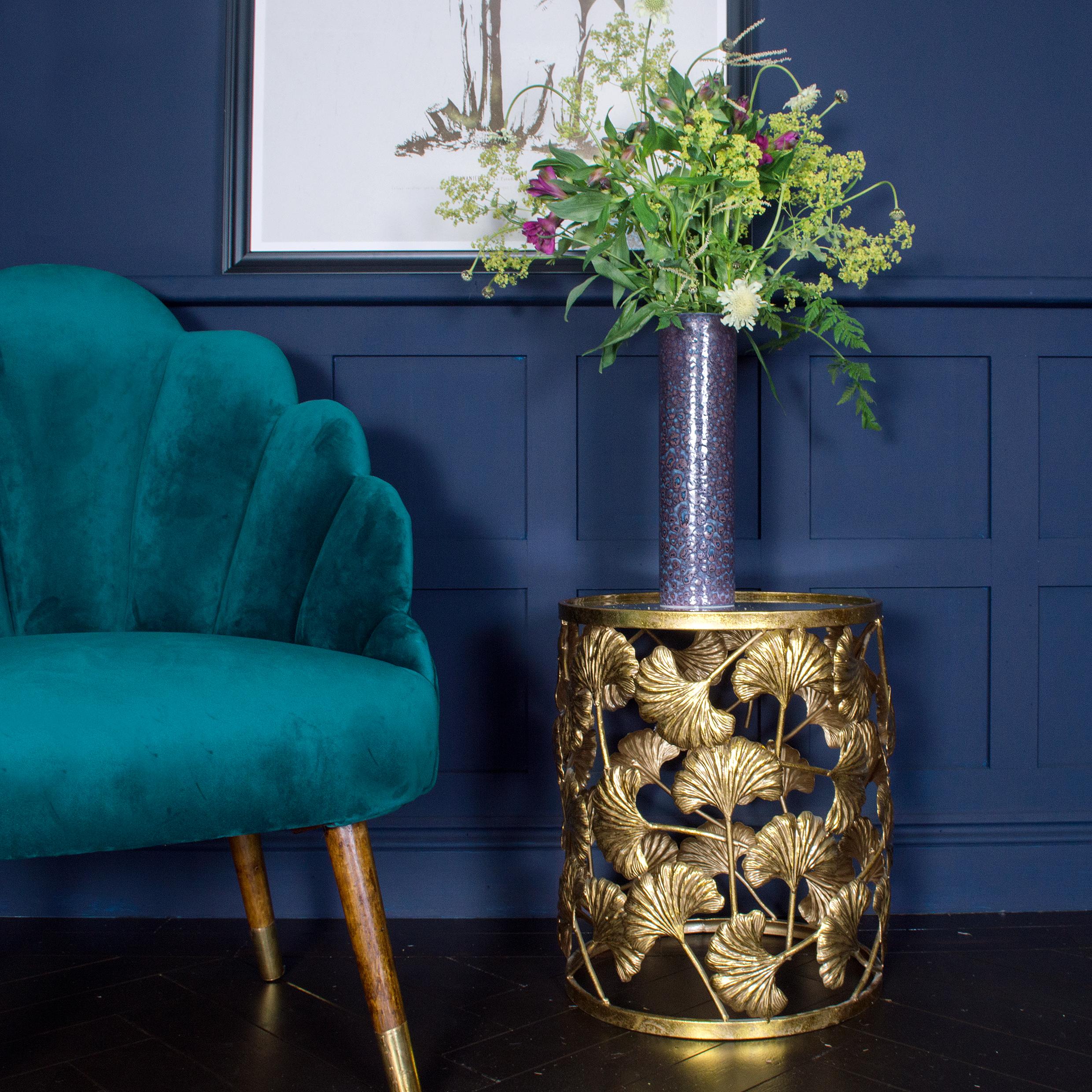 Find an interesting side table that adds intrigue to your eclectic living room