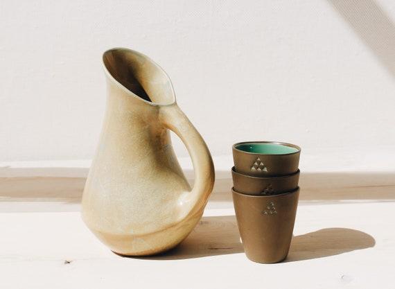 Use ‍a mix‍ of ⁣pottery and ‌ceramics for a handmade feel