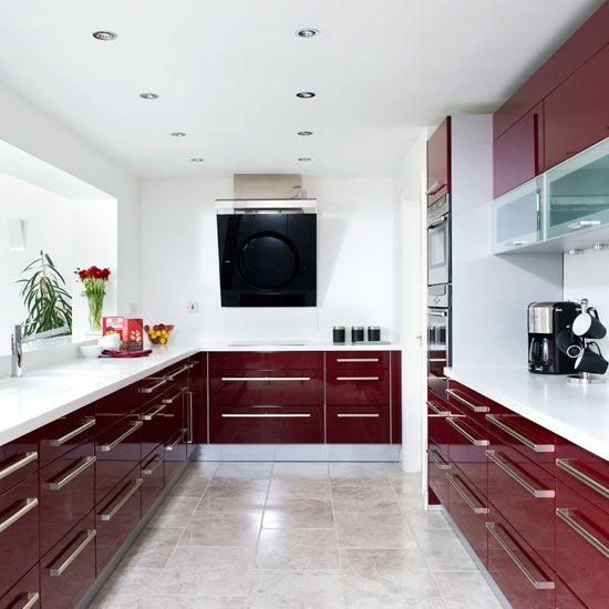 Incorporate white cabinetry to create a striking contrast in your burgundy kitchen