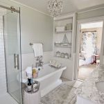 bathroom chandeliers diy master bathroom with pedestal tub, chandelier, and built  ins-www.goldenboysandme RZRSJWB