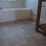 bathroom flooring ideas barn bathroom laminate floor2 -- i want this vinyl flooring in my renovated RPPAQCO