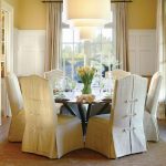 dining room chair covers traditional dining room idea in portland with yellow walls and dark  hardwood XHVVISJ