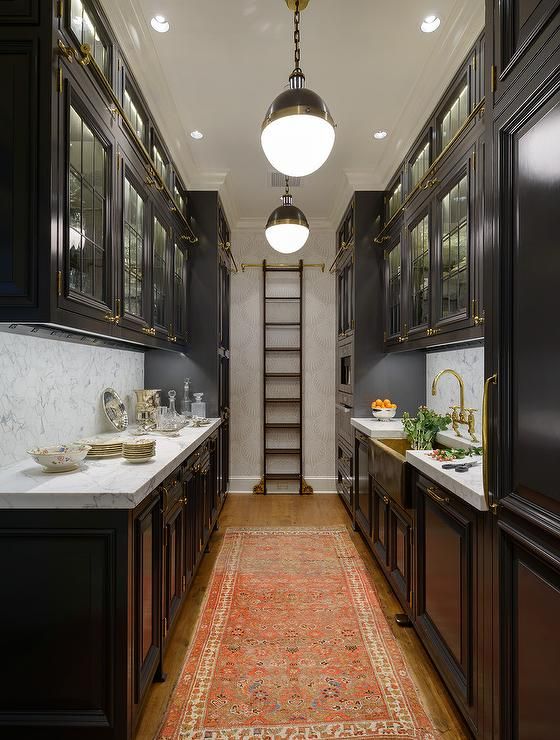 galley kitchens black galley style kitchen features a row of hicks pendants illuminating  glass BRRPURP