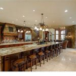 large kitchen island massive kitchen with two full-width islands. one island offers seating for  eight AIYDFNE
