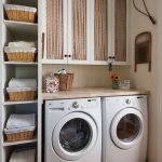 laundry room cabinets baskets around the washing machines DBESACZ