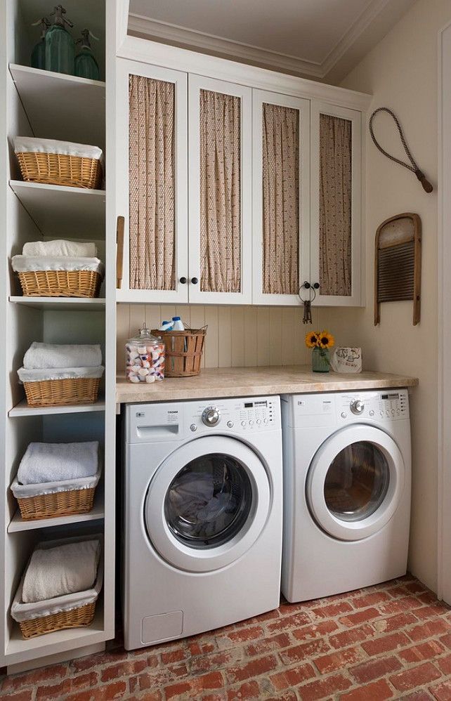 laundry room cabinets baskets around the washing machines DBESACZ