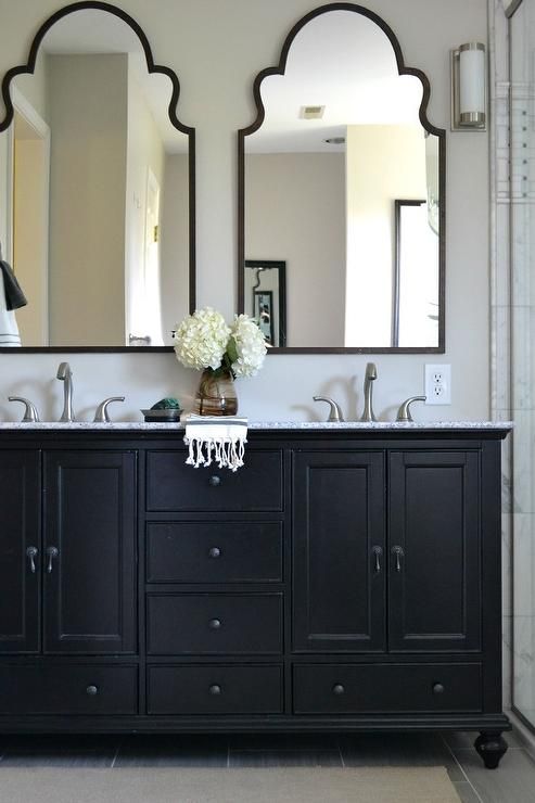 mirrors for bathrooms this neutral master bathroom features a beautiful black double vanity with  mirrors. YXICBMU