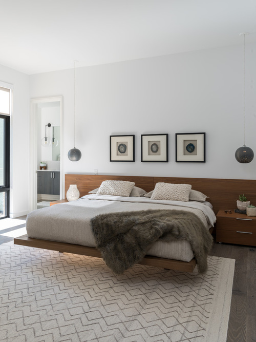 modern bedroom example of a minimalist master bedroom design in dallas with white walls KJCAXYP
