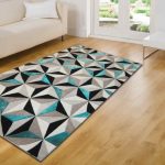 teal rugs the soft pile features a black, white with shimmering teal fibres that BTKPEVD