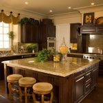 tuscan kitchen decor - loved counter tops against dark wood. UNXGUMG