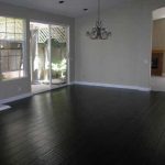 black hardwood flooring black hardwood floor to match stone fireplace, grey/yellow/ white decor CGFDQEK
