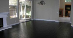 black hardwood flooring black hardwood floor to match stone fireplace, grey/yellow/ white decor CGFDQEK