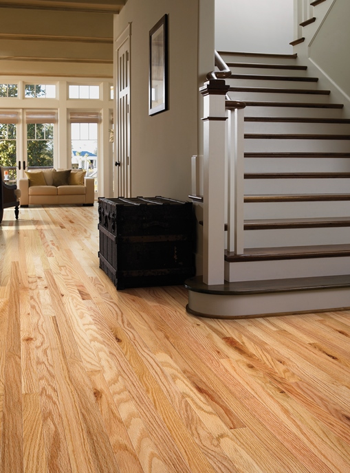 budget friendly flooring bright entryway with wide staircase and light oak harding hardwood floors WGTXELT
