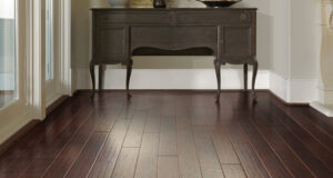 budget friendly flooring dark laminate or vinyl flooring that looks like wood HERRNWO