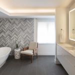 flooring ideas herringbone tile wall uplifts modern master bathroom ASFJFTV