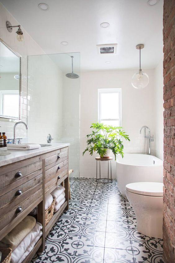 Patterned tiles create‌ stunning floors in farmhouse bathrooms