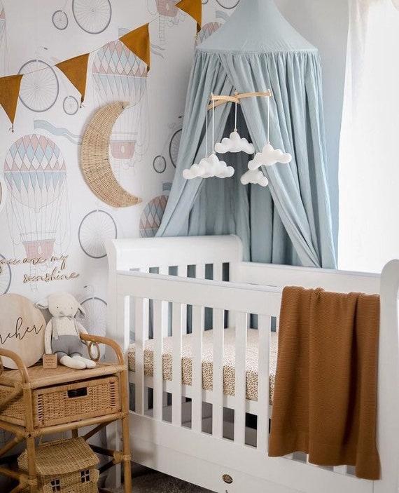 Cheerful cloud mobiles add whimsy and movement to your boy nursery