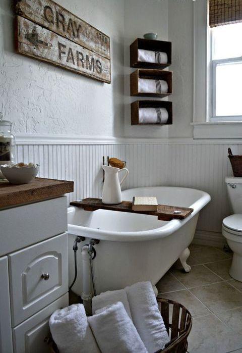 Farmhouse bathrooms with beadboard walls evoke countryside charm