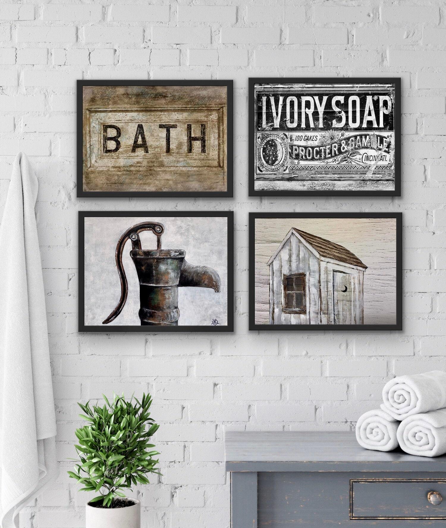 Hang vintage ​artwork for character in farmhouse bathrooms