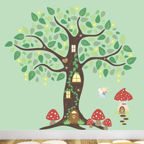 Nature-inspired wall decals transform a boy nursery into an enchanted forest