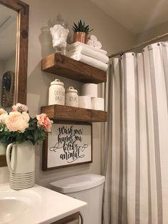 Farmhouse bathrooms thrive with cozy, textured textiles