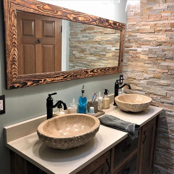 Hang vintage ‌mirrors to reflect light in farmhouse bathrooms