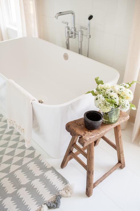 Incorporate a comfy stool for added farmhouse bathrooms comfort