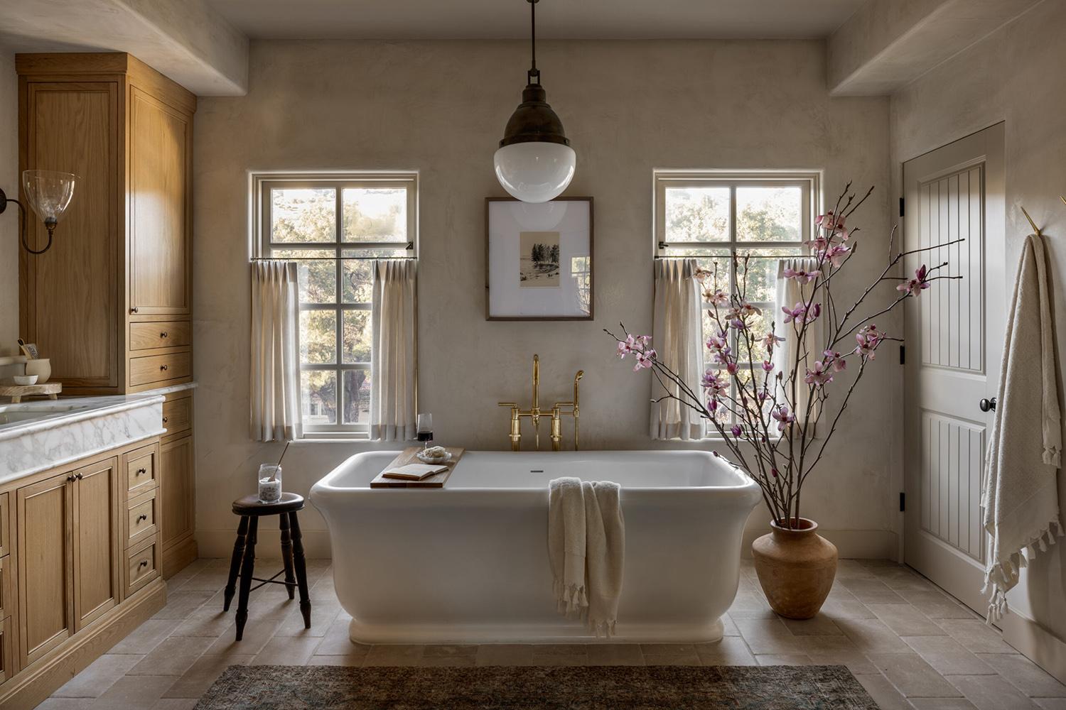 Soft, muted colors create a serene farmhouse bathrooms atmosphere