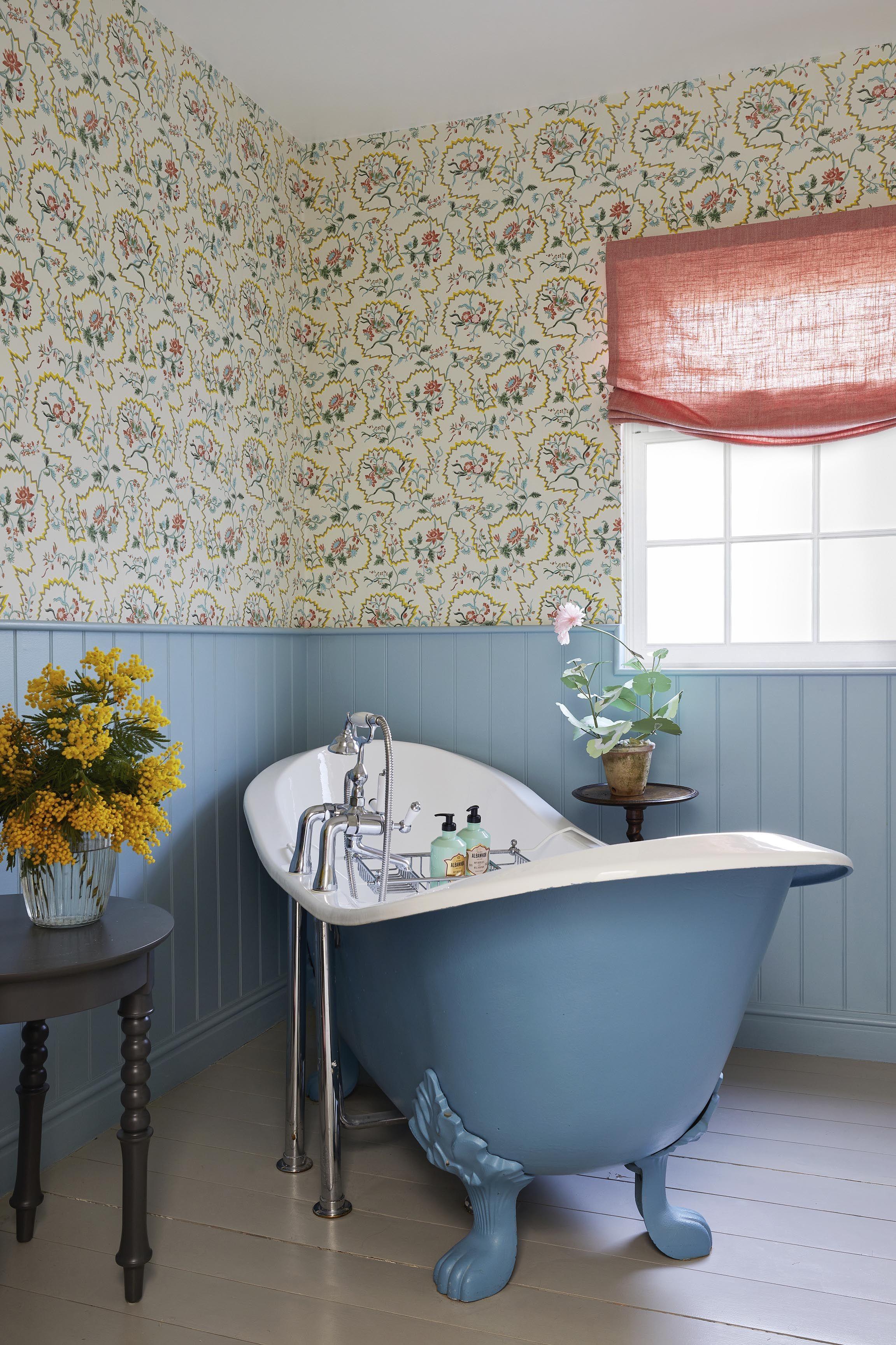 Bold wallpaper adds a playful touch to‌ farmhouse bathrooms