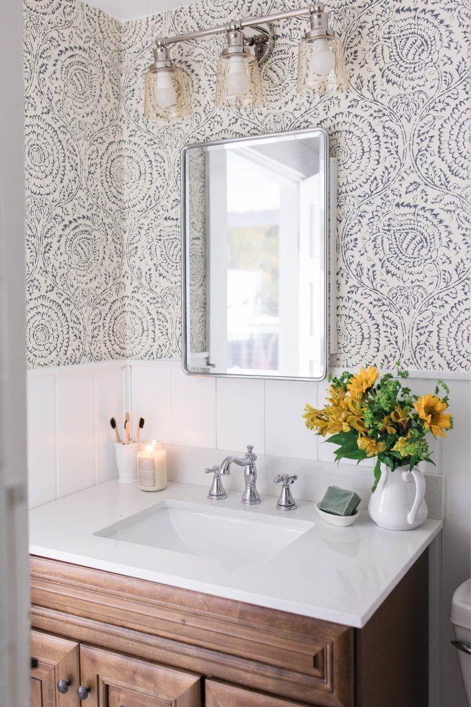 Choose patterned wallpaper to create depth in farmhouse bathrooms