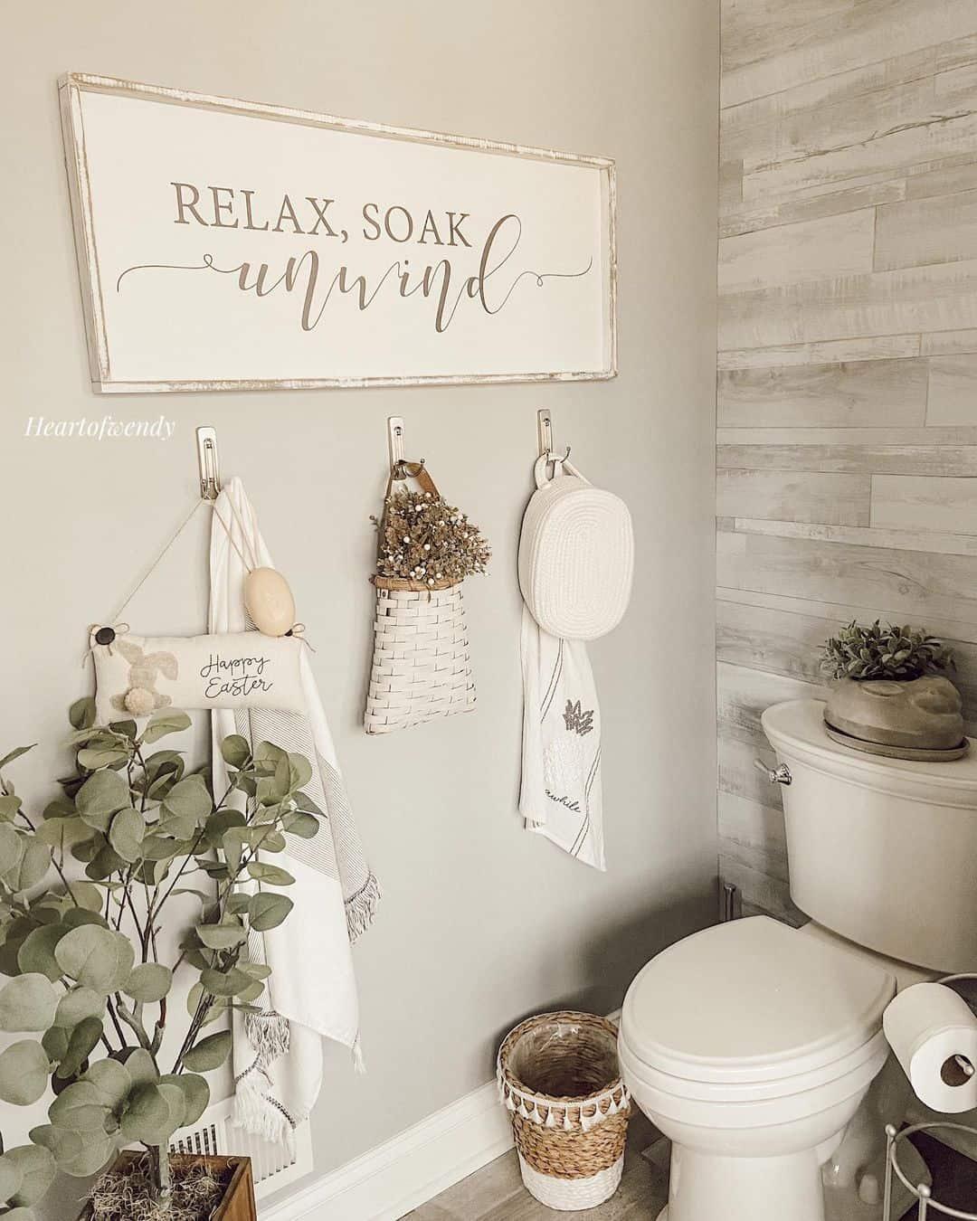 Create a ‌statement wall with wallpaper in farmhouse bathrooms