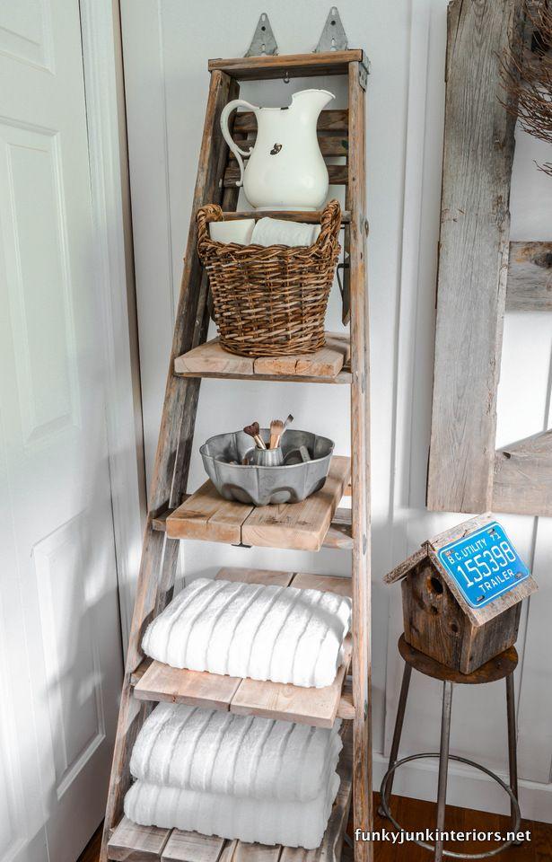 Create a vintage ladder for towel storage in farmhouse bathrooms