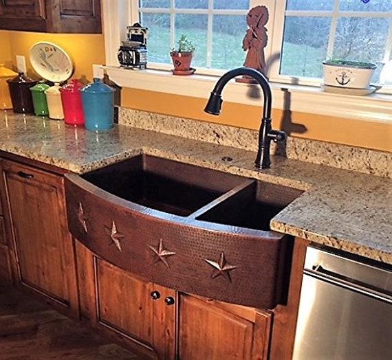 A sturdy farmhouse sink adds character and functionality to your Farmhouse Kitchen