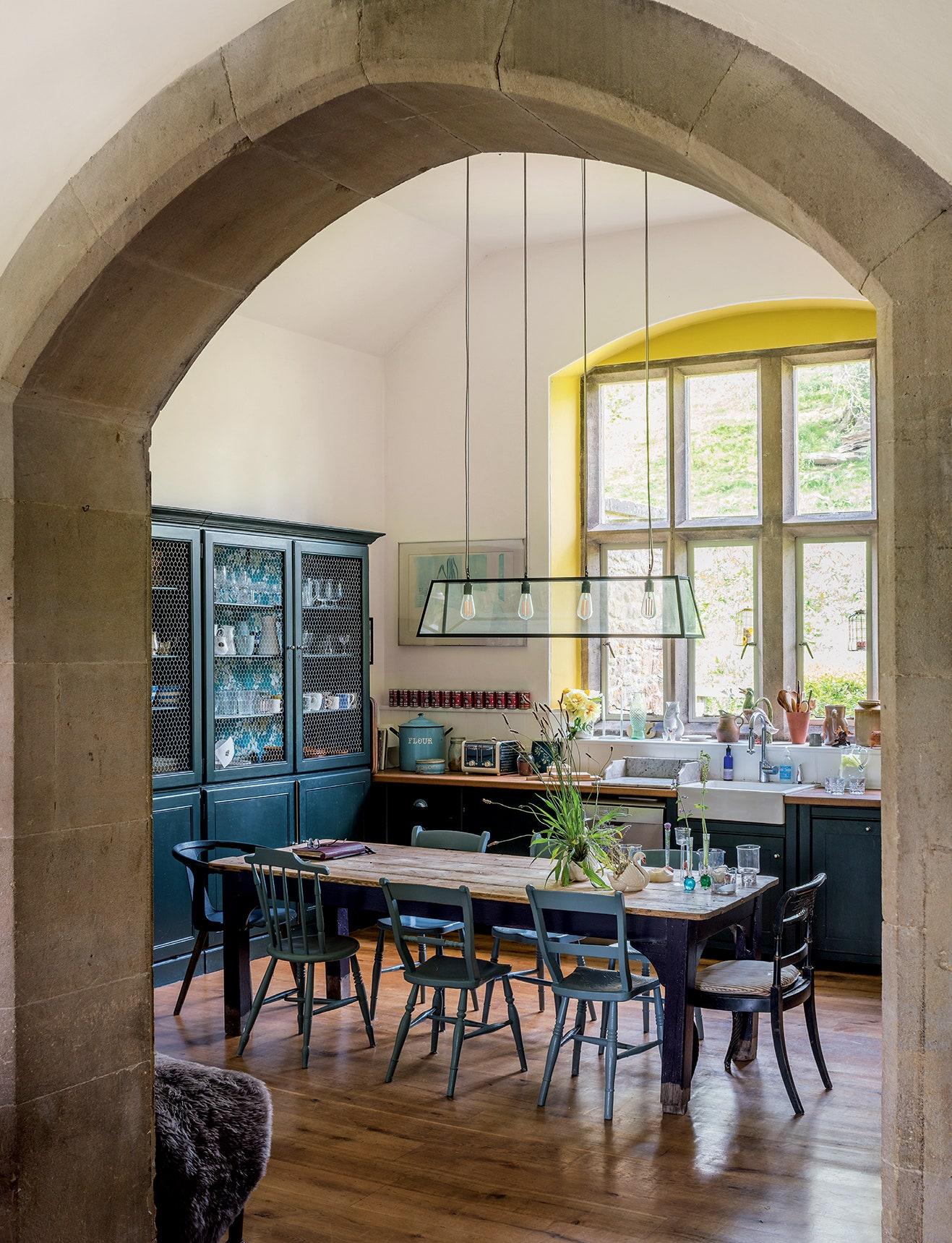 Comfortable, mismatched dining chairs add charm to your Farmhouse Kitchen