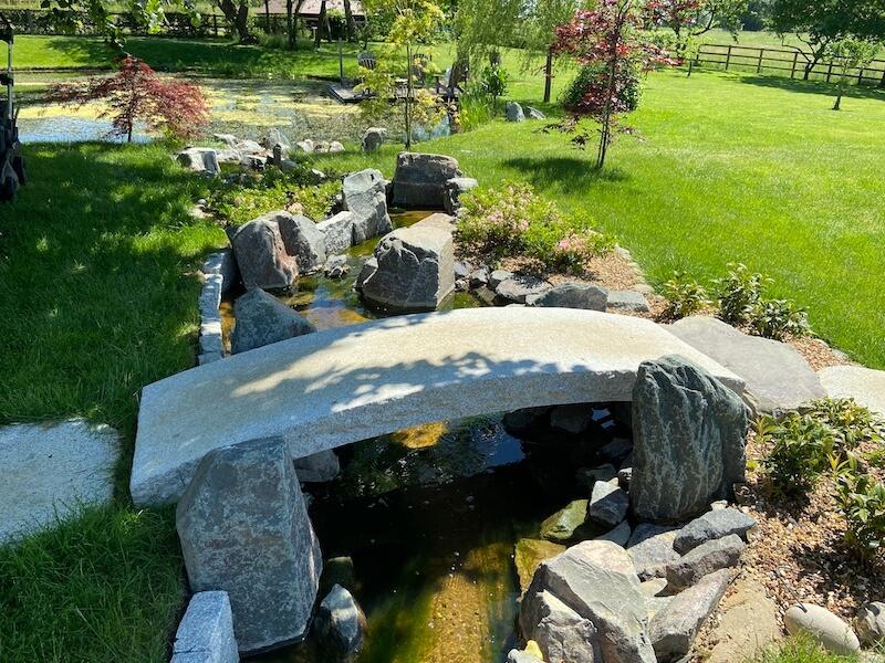 Miniature⁢ bridges invite reflection in the peaceful realm of a Zen Garden