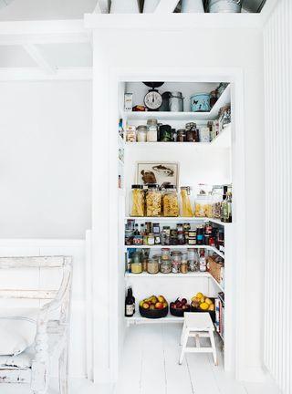 Utilize clear containers for visibility in your galley kitchen pantry