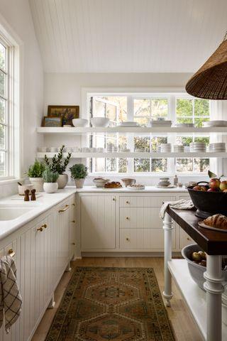 Implement a window shelf for plants and decor in your galley kitchen