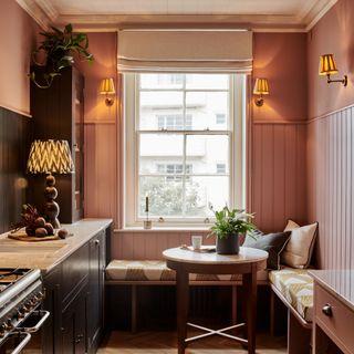 Create a cozy breakfast nook with built-in seating in ​your galley kitchen