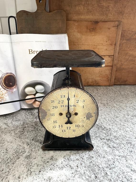 A decorative scale blends vintage charm into your farmhouse kitchen design